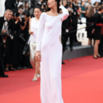 Bella Hadid, in a vintage Gucci dress with a slit on the thigh, took to the red carpet of Cannes