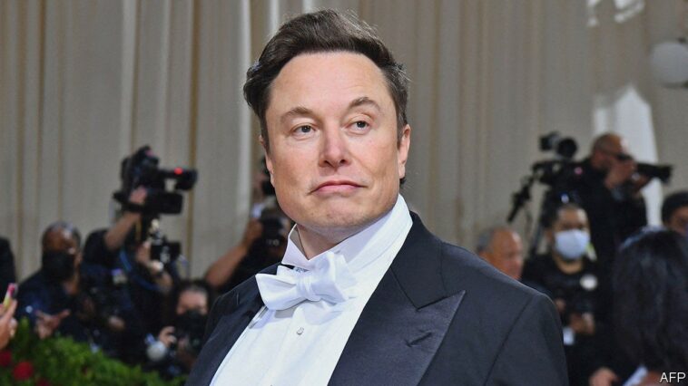 (FILES) In this file photo taken on May 02, 2022, Elon Musk arrives for the 2022 Met Gala at the Metropolitan Museum of Art in New York. - Elon Musk on May 10, 2022, said he would lift Twitter's ban on former US president Donald Trump if Musk's deal to buy the global messaging platform is successful. "I would reverse the ban," the billionaire said at a Financial Times conference, noting that he doesn't own Twitter yet, so "this is not like a thing that will definitely happen." (Photo by Angela Weiss / AFP) (Photo by ANGELA WEISS/AFP via Getty Images)