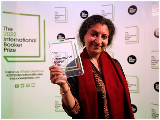 Author Geetanjali Shree poses with the 2022 International Booker Prize award for her novel