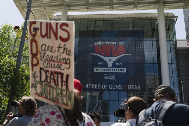 Protesters gather outside of the NRA's annual meeting in Houston.