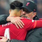 Liverpool manager Jurgen Klopp embraces Virgil van Dijk after the Champions League final