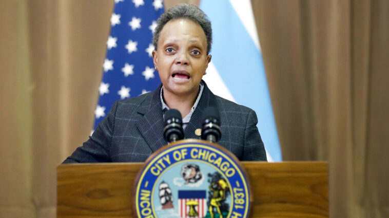 Lightfoot slams Abbott for criticizing Chicago gun laws