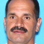 Dead: Police were searching for
Julian Paris, 54, who allegedly shot dead his wife at a crowded park in Florida