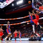 FILE PHOTO: Mar 9, 2022; Detroit, Michigan, USA;  Chicago Bulls guard Ayo Dosunmu (12) is fouled by Detroit Pistons forward Isaiah Livers (12) in the second half at Little Caesars Arena. Mandatory Credit: Rick Osentoski-USA TODAY Sports