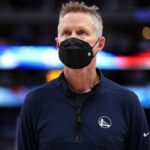 DALLAS, TEXAS - MAY 24: Head coach Steve Kerr of the Golden State Warriors looks on during the national anthem prior to Game Four of the 2022 NBA Playoffs Western Conference Finals against the Dallas Mavericks at American Airlines Center on May 24, 2022 in Dallas, Texas. NOTE TO USER: User expressly acknowledges and agrees that, by downloading and or using this photograph, User is consenting to the terms and conditions of the Getty Images License Agreement.   Tom Pennington/Getty Images/AFP (Photo by TOM PENNINGTON / GETTY IMAGES NORTH AMERICA / Getty Images via AFP)