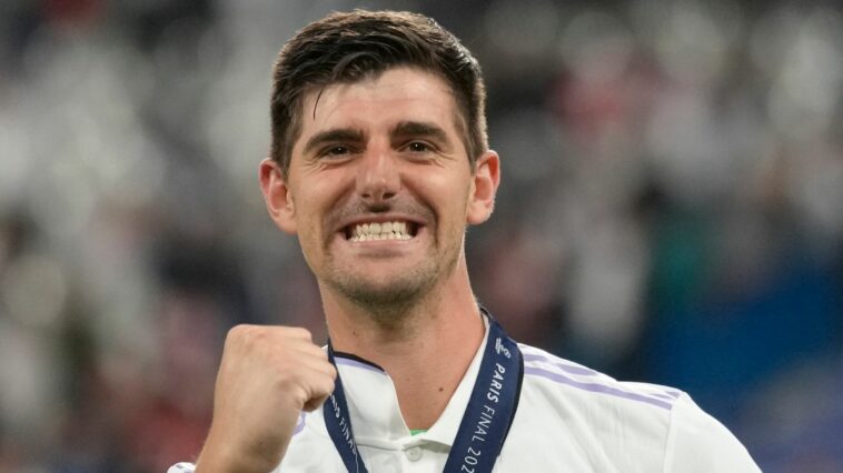 Real Madrid's goalkeeper Thibaut Courtois celebrates after winning the Champions League final