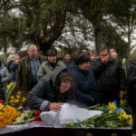 Family members, friends, and others attending the funeral of the soldier Oleksandr Panichenko, 28, in Borodyanka, Ukraine, on Sunday.