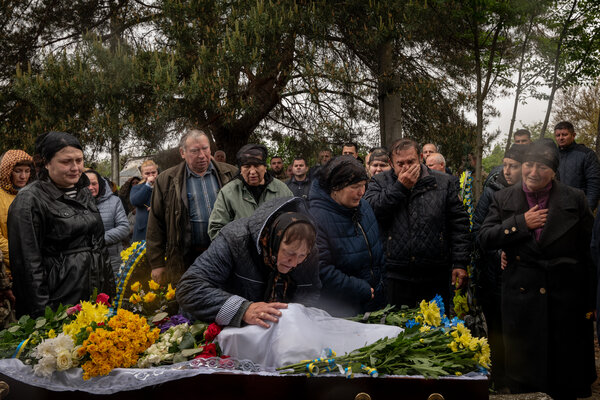 Family members, friends, and others attending the funeral of the soldier Oleksandr Panichenko, 28, in Borodyanka, Ukraine, on Sunday.