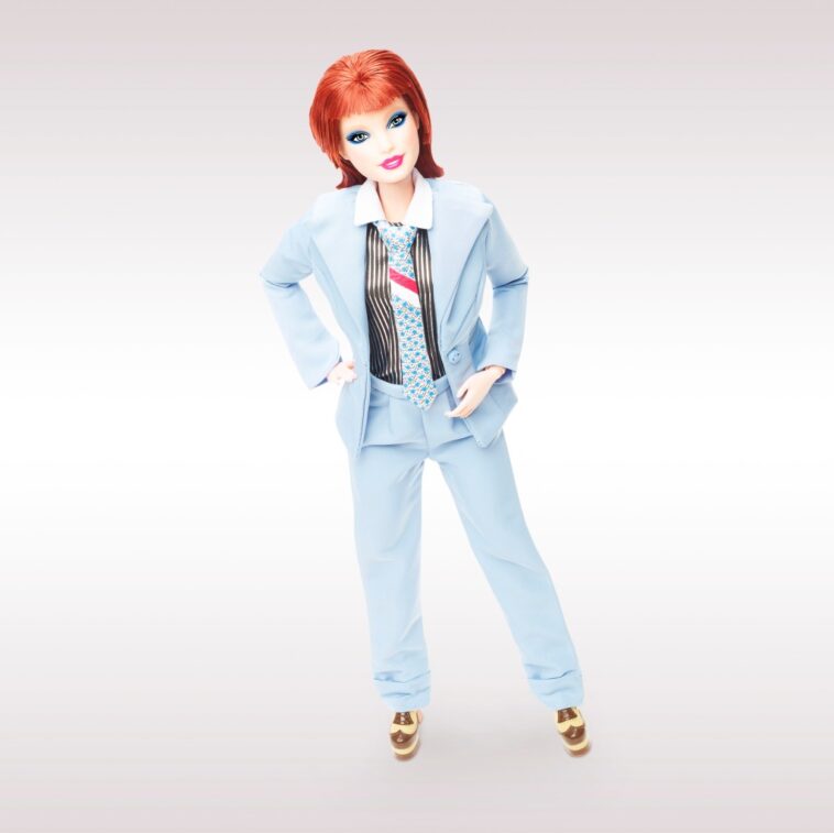 Barbie is paying tribute to music icon David Bowie with a new doll replicating his famous “Life on Mars” music video look. The second limited edition Barbie Signature Collection doll honouring the singer is being released to mark the 50th anniversary of the Hunky Dory album. Barbie Bowie wears the powder-blue suit from Bowie’s Life on Mars video from Hunky Dory, complimented by a foil-printed pinstripe shirt, a tie and platform shoes. The doll also has bold blue eyeshadow and a hairstyle inspired by Bowie’s 70s glam. Barbie first saluted Bowie three years ago by recreating his Ziggy Stardust alter-ego, complete with space suit and makeup. The David Bowie Barbie Doll 2 is available from MattelCreations.com priced at $50. BYLINE: Mattel/Mega. 29 Jun 2022 Pictured: Barbie pays tribute to music icon David Bowie with a new doll replicating his famous “Life on Mars” music video look. *BYLINE: Mattel/Mega. Photo credit: Mattel/Mega TheMegaAgency.com +1 888 505 6342 (Mega Agency TagID: MEGA873361_001.jpg) [Photo via Mega Agency]