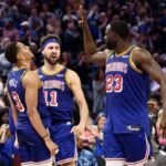 Jordan Poole #3 of the Golden State Warriors is congratulated by Klay Thompson #11 and Draymond Green #23 after making a three point basket against the Utah Jazz in the fourth quarter at Chase Center on April 02, 2022 in San Francisco, California.