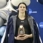 Mar 17, 2022; Atlanta, Georgia, USA; Penn Quakers swimmer Lia Thomas holds a trophy after finishing first in the 500 free at the NCAA Womens Swimming & Diving Championships at Georgia Tech.