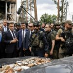 French president visits Kyiv suburb, decries 'massacre'