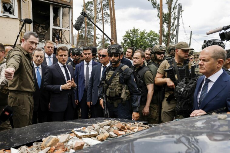 French president visits Kyiv suburb, decries 'massacre'