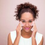 Woman washing face