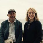 Kezia Rice with her dad by the seaside