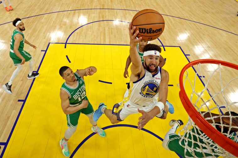 FILE PHOTO: Jun 5, 2022; San Francisco, California, USA; Golden State Warriors guard Klay Thompson (11) shoots the ball against Boston Celtics guard Jaylen Brown (7) during game two of the 2022 NBA Finals at Chase Center. Mandatory Credit: Jed Jacobsohn/pool photo-USA TODAY Sports