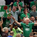 Former Boston Celtics player Bill Walton cheers with fans in the third quarter during Game Three of the 2022 NBA Finals against the Golden State Warriors at TD Garden on June 08, 2022 in Boston, Massachusetts