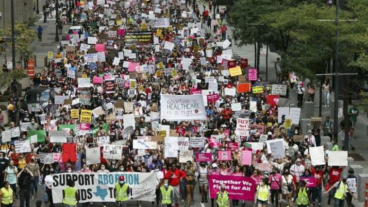 THOUSANDS march through the US in protest of abortion law