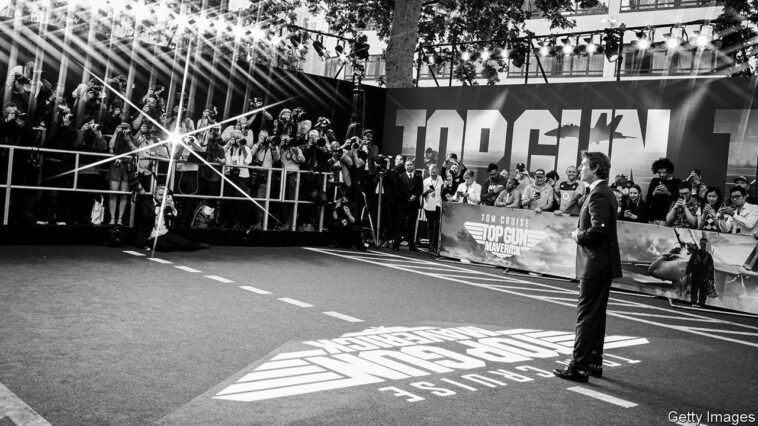 LONDON, ENGLAND - MAY 19: (EDITORS NOTE: Image has been converted to black and white, and taken with a starburst filter) Tom Cruise attends The Royal Film Performance & UK Premiere of "Top Gun: Maverick" in Leicester Square on May 19, 2022 in London, England. (Photo by Gareth Cattermole/Getty Images for Paramount Pictures)