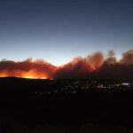 Western wildfires force evacuations in Arizona, California