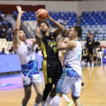 Mikey Williams (middle) connected on 10 of 20 attempts from the flfloor to lead TNT past Phoenix. —PBA IMAGES