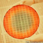 An Intel employee holds a silicon wafer used to make chips at the company's complex in Chandler, Ariz., Nov. 17, 2021. Making millions of these tiny components means building, and spending, big for companies like Intel, a Silicon Valley titan. (Philip Cheung/The New York Times)Credit: New York Times / Redux / eyevineFor further information please contact eyevinetel: +44 (0) 20 8709 8709e-mail: info@eyevine.comwww.eyevine.com