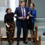 The new Speaker, Milton Dick, is dragged to the chair by the member for Bendigo Lisa Chesters and the member for Macquarie Susan Templeman.