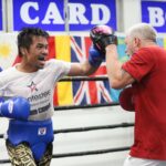 Manny Pacquiao does mitts with trainer Freddie Roach.