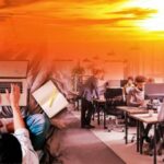 On the left someone is sitting in bed on their laptop. On the right people are working in an office. At the top of the image is a yellow and orange sky with the sun burning bright.