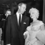 Joe DiMaggio escorts ex-wife Marilyn Monroe to the premiere of her movie The Seven Year Itch