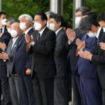 Japan’s Leader Tries to Honor Abe’s Legacy, While Building His Own