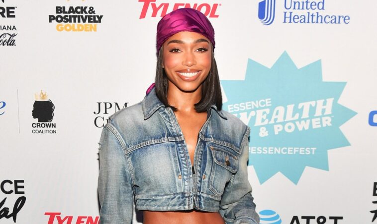 Lori Harvey Discusses Wealth & Power in Cropped Saint Laurent Jacket With Tom Ford Crocodile Leather Heels at Essence Festival