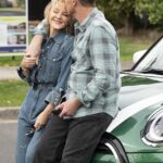 Now we're back together': Kylie Minogue brings back the curls as she cosies up to her on and former off screen lover Jason Donovan to film scenes for the final episode of Neighbours