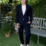 Nolan Gerard Funk Discusses Neckwear at Delvaux Party