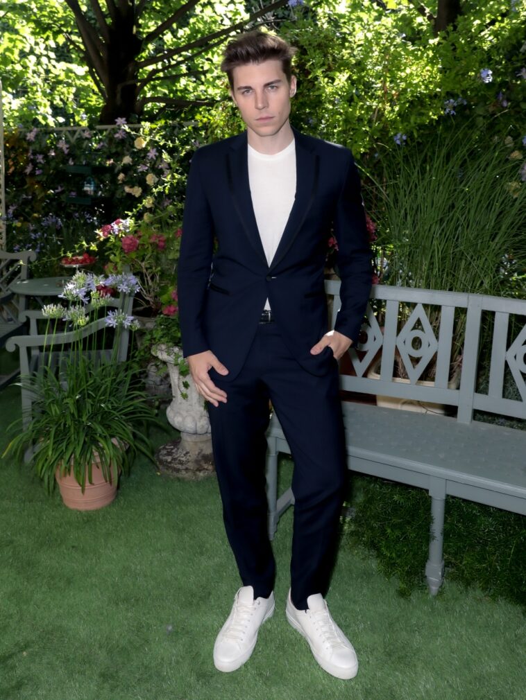 Nolan Gerard Funk Discusses Neckwear at Delvaux Party