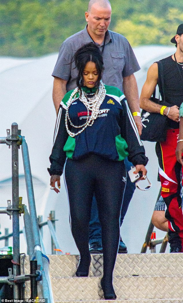 Glowing: Rihanna looked incredible as she made a rare appearance to support boyfriend ASAP Rocky at his concert during the Lollapalooza festival on Sunday in Paris, France