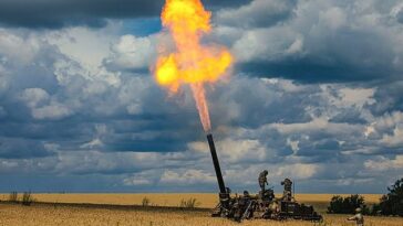 Russian soldiers fire a 2S4 Tyulpan self-propelled heavy mortar from their position at an undisclosed location in Ukraine today