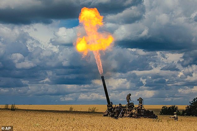 Russian soldiers fire a 2S4 Tyulpan self-propelled heavy mortar from their position at an undisclosed location in Ukraine today