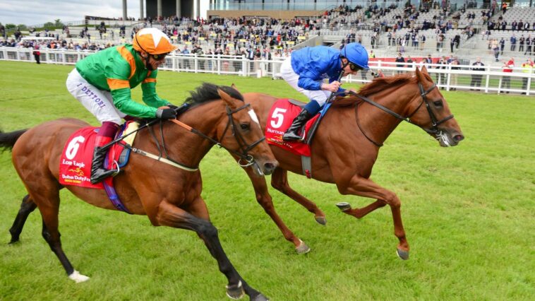 William Buick celebrates as he beats Frankie Dettori to win the Irish Derby on Hurricane Lane