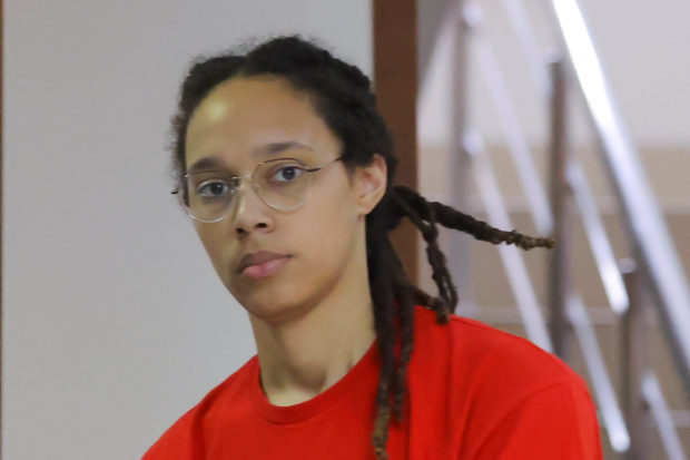 U.S. basketball player Brittney Griner, who was detained in March at Moscow's Sheremetyevo airport and later charged with illegal possession of cannabis, is escorted before a court hearing in Khimki, outside Moscow, Russia July 7, 2022.  REUTERS/Evgenia Novozhenina