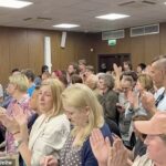 Gorinov said 'many of my fellow citizens feel shame and guilt' over conflict in Ukraine. This sentiment is clearly shared as defiant Russians stand and applaud him as he is sentenced