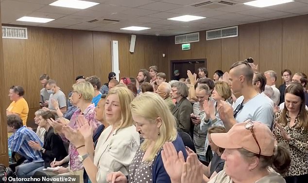 Gorinov said 'many of my fellow citizens feel shame and guilt' over conflict in Ukraine. This sentiment is clearly shared as defiant Russians stand and applaud him as he is sentenced