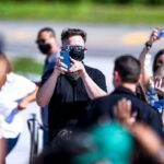 SpaceX CEO Elon Musk takes photos with his phone during the Inspiration4 crew send off at NASAs Kennedy Space Center in Florida, on September 15, 2021. - SpaceX is preparing to send the first all-civilian crew into Earth orbit on the evening of September 15, capping a summer of private spaceflight with one of the most ambitious tourism missions to date. (Photo by CHANDAN KHANNA / AFP) (Photo by CHANDAN KHANNA/AFP via Getty Images)