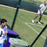 Tennis - Wimbledon - All England Lawn Tennis and Croquet Club, London, Britain - July 9, 2022  Australia's Nick Kyrgios during training as Serbia's Novak Djokovic walks past after his training REUTERS/Toby Melville