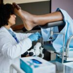 A female gynaecologist collecting samples during a smear test