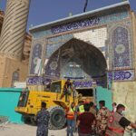 Frantic rescue effort under way at Iraq shrine hit by landslide