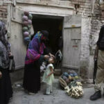 Gunmen kill two policemen escorting polio workers in Pakistan