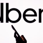 Japanese giant SoftBank dumps its entire stake in Uber as losses mount at its investment unit