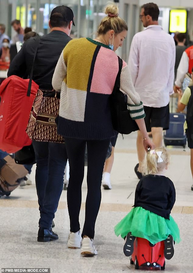 Karl Stefanovic and his wife Jasmine's daughter Harper took an accidental tumble at Brisbane Airport on Friday