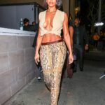 Lori Harvey Goes Bold in Snakeskin Roberto Cavalli Pants and Jacquemus Top to Kylie Cosmetics Ulta Launch